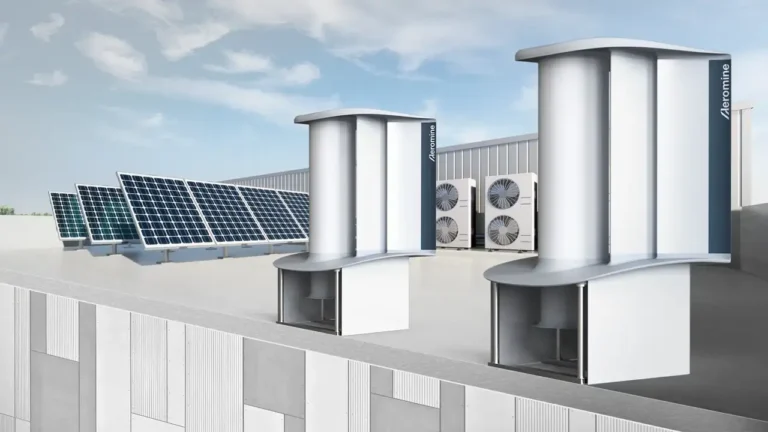 Unidades de energia eólica sem pás da Aeromine instaladas no telhado de um prédio, capturando vento sem usar hélices visíveis.