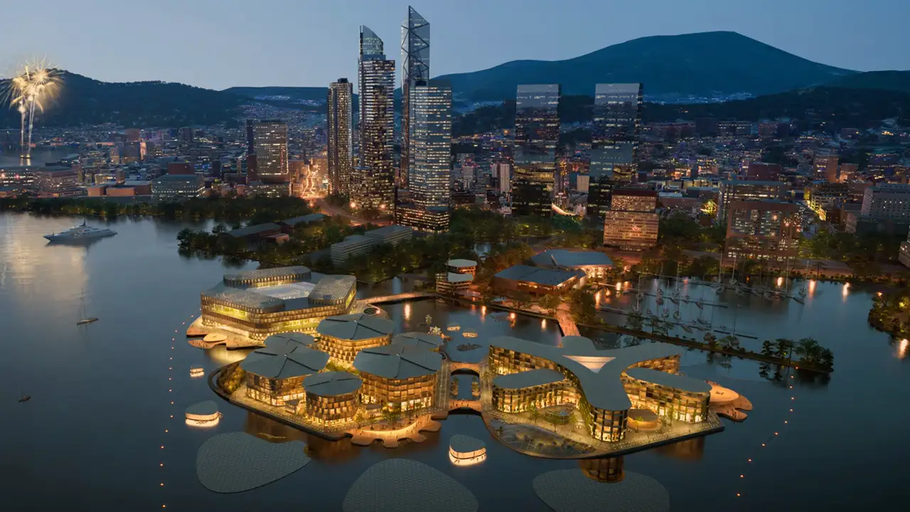 Vista aérea da Oceanix Busan, a cidade flutuante composta por plataformas hexagonais conectadas sobre o mar.